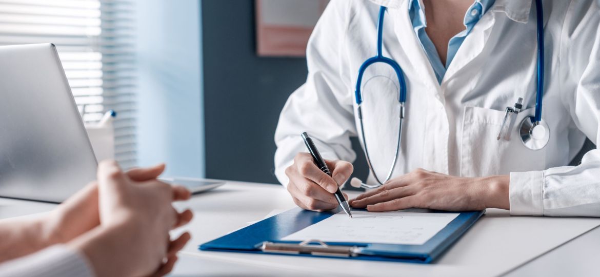 Doctor writing a medical prescription